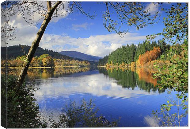 Reflections on a scottish loch Canvas Print by Peter Mclardy