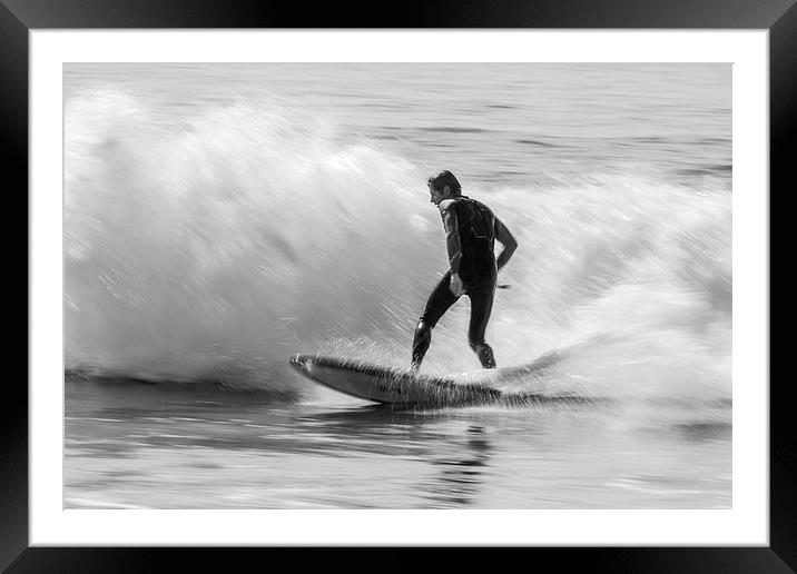 Surfing a beach break Framed Mounted Print by Ian Jones