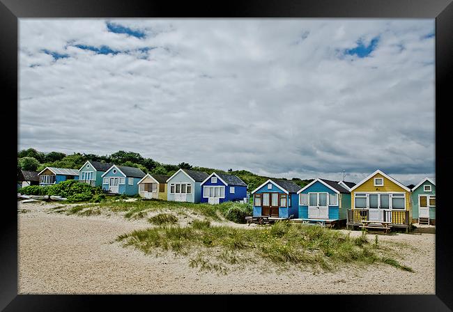 Beach huts on Mudeford Spit Framed Print by Dan Ward