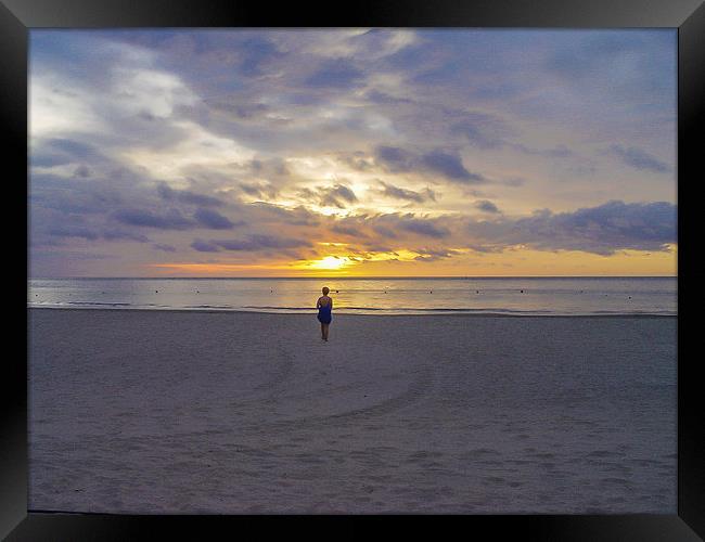 Contemplation at sunset in Borneo Framed Print by colin chalkley