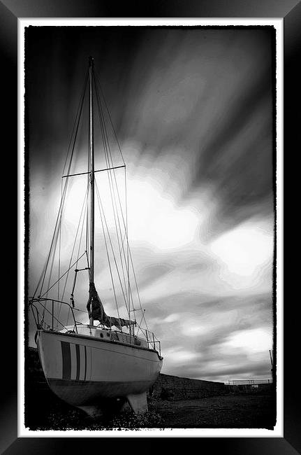 Boat on the harbor Framed Print by Andrew chittock