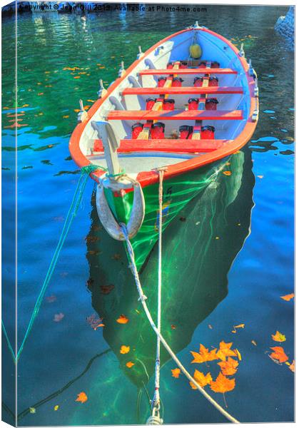 Dinghy and autumn leaves Canvas Print by Jean Gill
