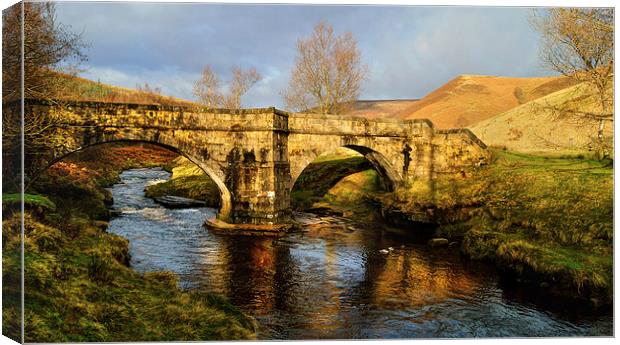 Slippery Stones Packhorse Bridge Canvas Print by Darren Galpin