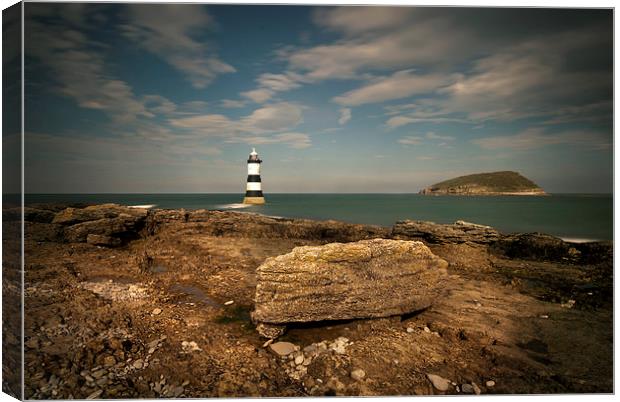 Penmon Point Lighthouse and Puffin Island Canvas Print by Eddie John
