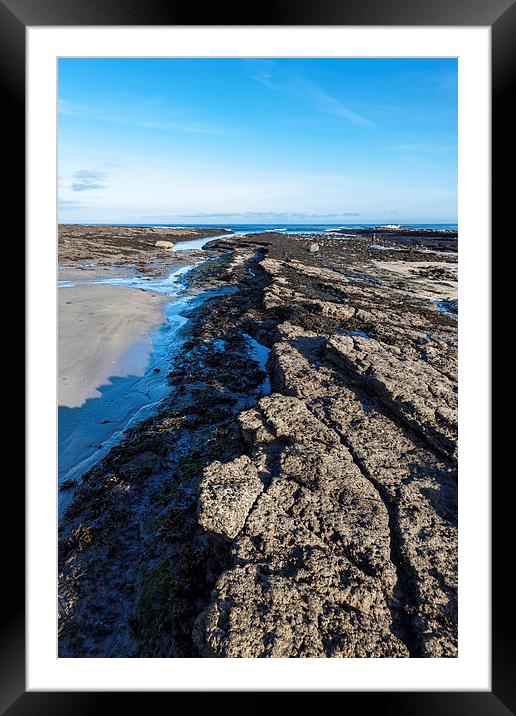 Rocky beach Framed Mounted Print by Gary Finnigan