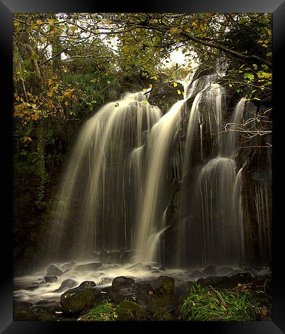 Waterfall in the Autumn Framed Print by Peter Mclardy