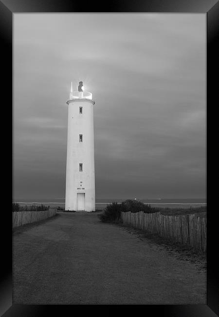 Lighthouse at first light Framed Print by Ian Jones