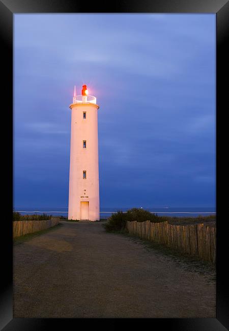 Lighthouse at first light Framed Print by Ian Jones