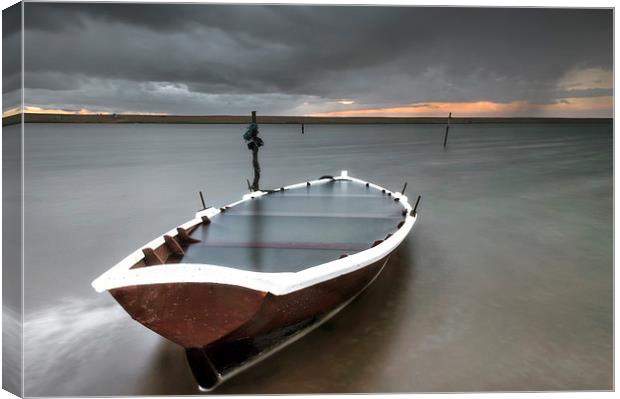 Run aground at Chesil Canvas Print by Chris Frost