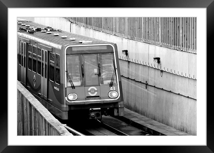 DLR train at City Airport Framed Mounted Print by Robert Cane