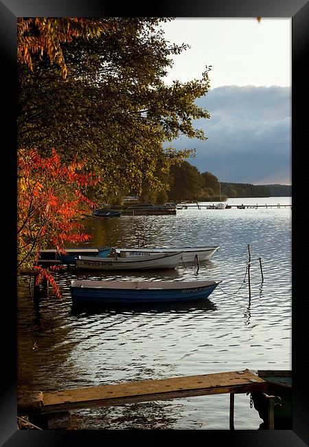 Fishing pier on a lake Framed Print by Robert Parma