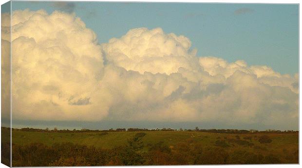 Clouds Over The Hill Canvas Print by Antoinette B