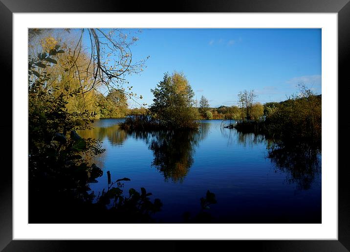 November blue skies and water Framed Mounted Print by Sue Bottomley