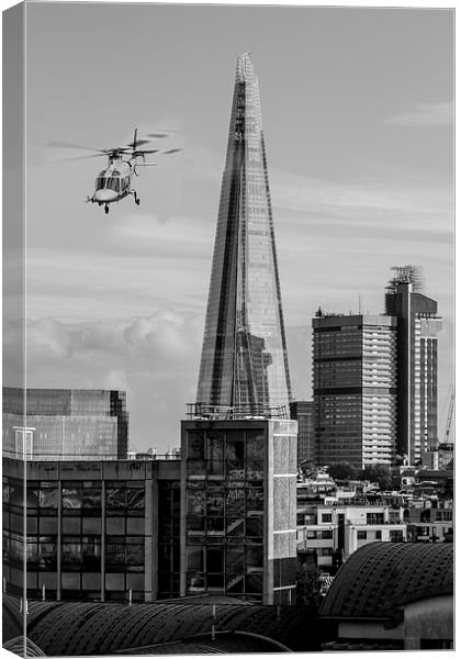 The Shard helicopter fly past Canvas Print by Ian Jones