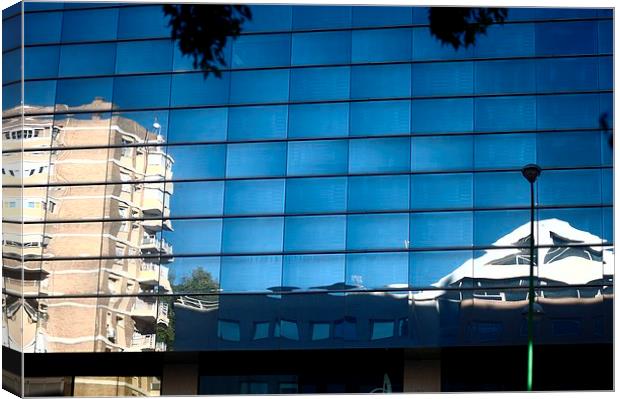Reflection on a building Canvas Print by Jose Manuel Espigares Garc