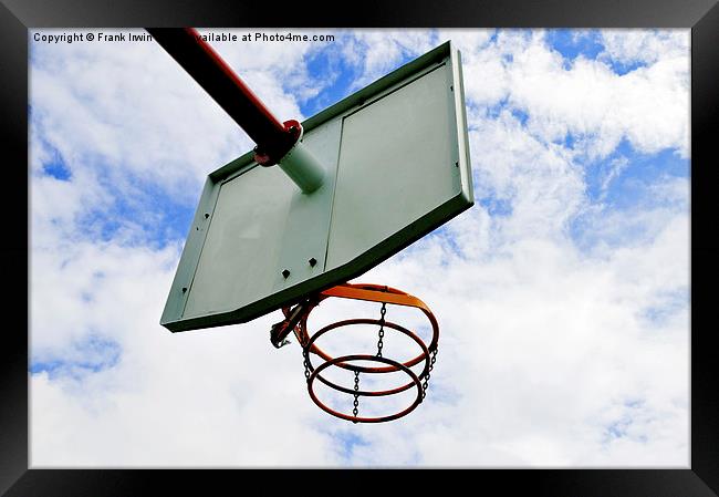 A basketball hoop against a blue sky Framed Print by Frank Irwin