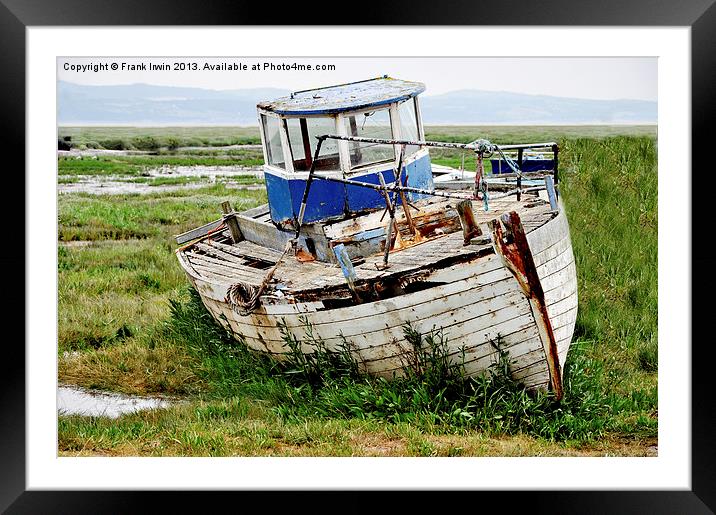 An abandoned and worse for wear boat Framed Mounted Print by Frank Irwin