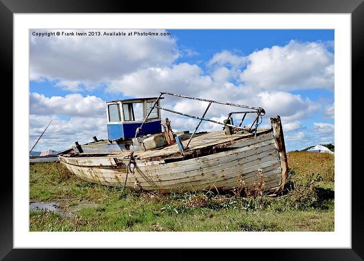 An abandoned and worse for wear boat Framed Mounted Print by Frank Irwin