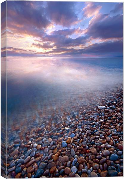 Pebble rush Canvas Print by Mike Woodland