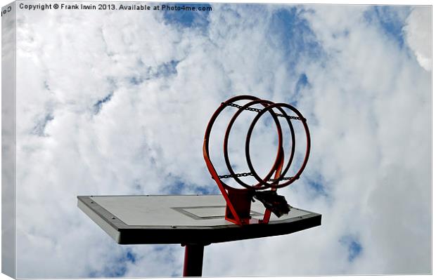 A basketball hoop against a blue sky Canvas Print by Frank Irwin