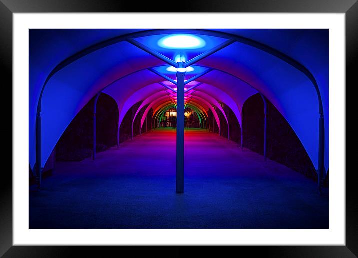 Tunnel to North Greenwich Pier - Blue Lights Framed Mounted Print by John Ly