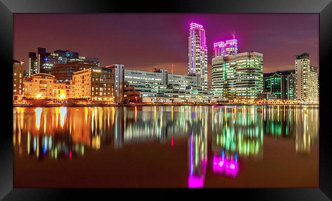 Pink Glow at Canary Wharf Framed Print by John Ly