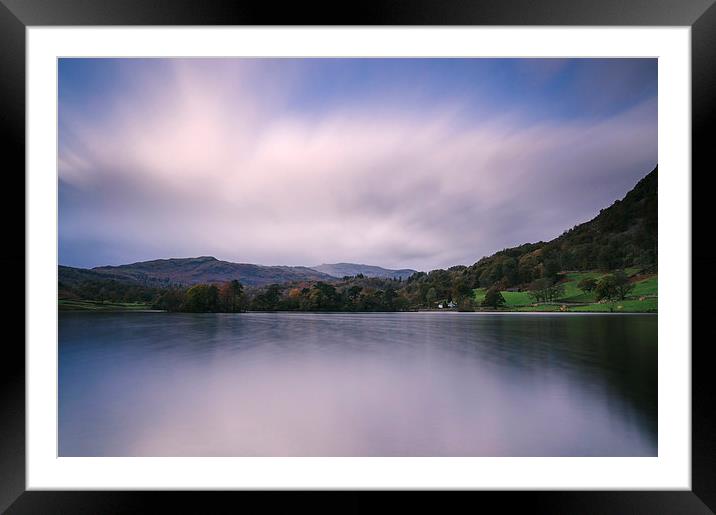 Clouds sweeping over Rydal Water at dusk. Framed Mounted Print by Liam Grant