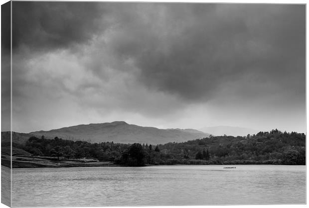 Rainclouds and rain over Rydal Water at dusk. Canvas Print by Liam Grant