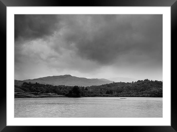 Rainclouds and rain over Rydal Water at dusk. Framed Mounted Print by Liam Grant