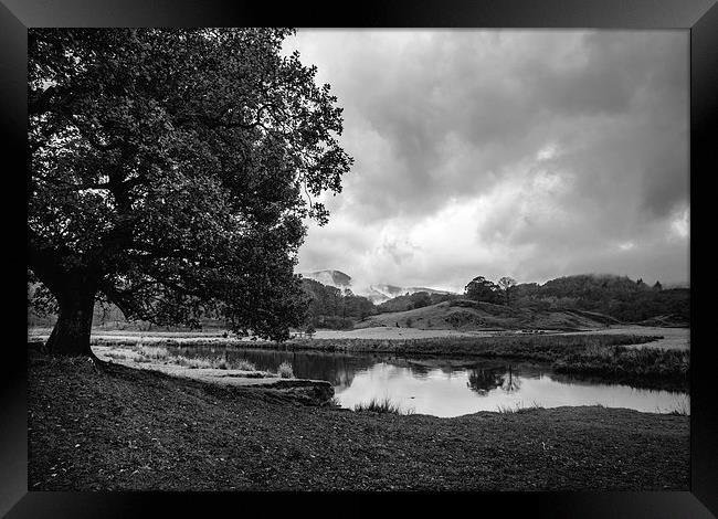 Dramatic sky and reflections on the River Brathay  Framed Print by Liam Grant
