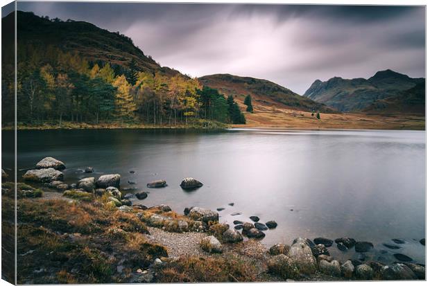 Clouds over Blea Tarn with Langdale Pikes beyond. Canvas Print by Liam Grant