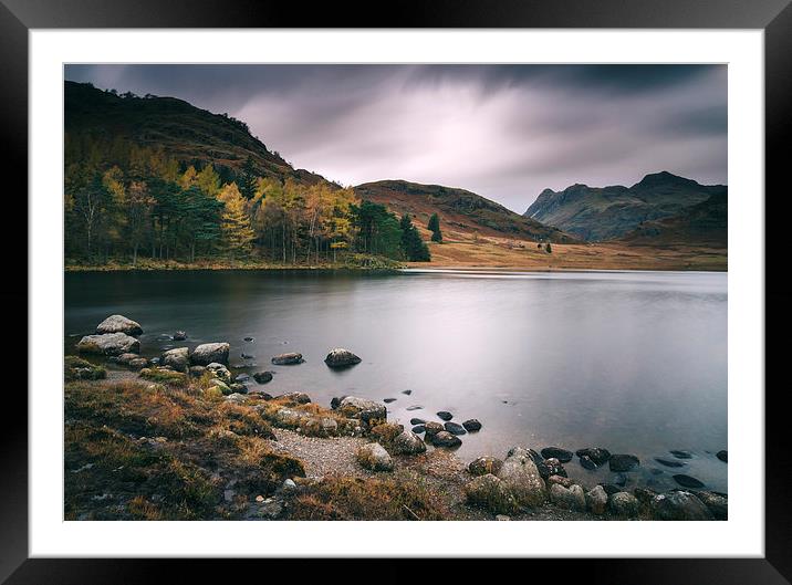 Clouds over Blea Tarn with Langdale Pikes beyond. Framed Mounted Print by Liam Grant