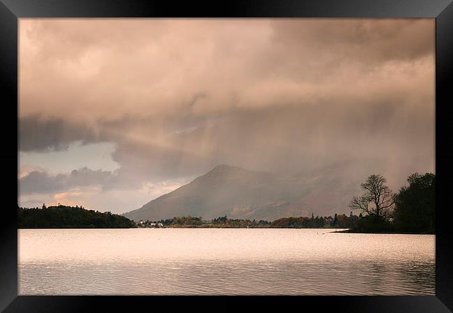 Evening rainclouds and distant rain over Skiddaw a Framed Print by Liam Grant