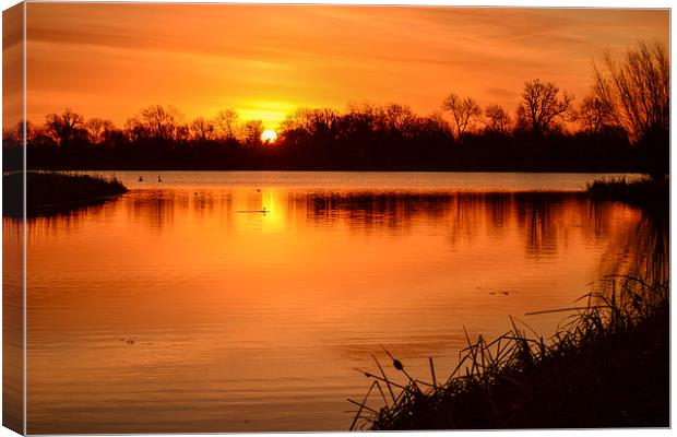 Sunrise over the lake Canvas Print by Keith Douglas