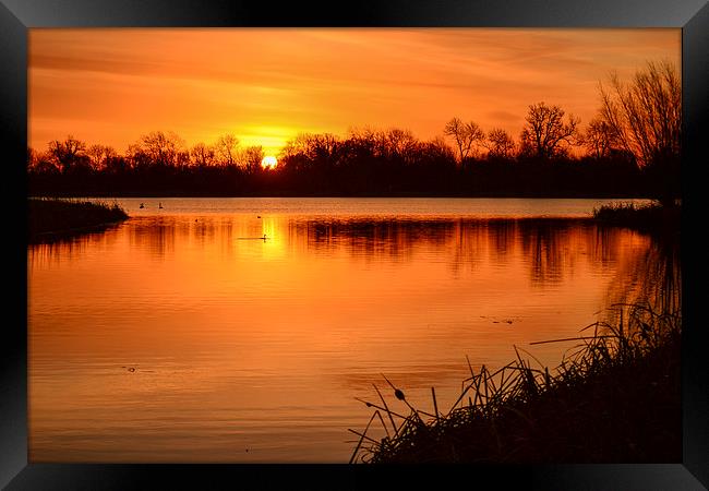 Sunrise over the lake Framed Print by Keith Douglas