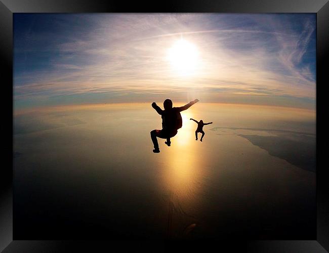 skydive sunset over the bay Framed Print by Ewan Cowie