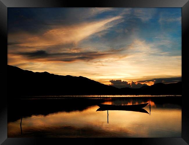Vietnam sunset over the lagoon Framed Print by Ewan Cowie