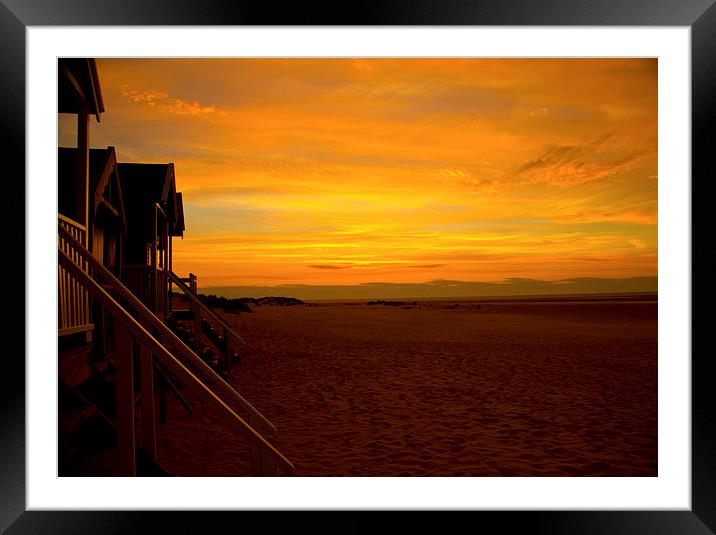 Sunset on the beach huts Framed Mounted Print by Colin Brittain