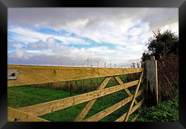 Somerton Church Gate Looking at Windturbines Framed Print by James Taylor