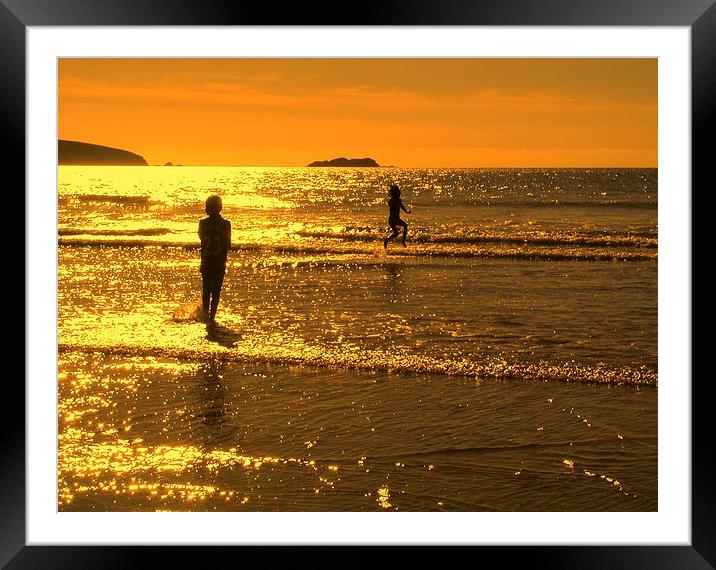 Childrens seaside splash Broadhaven sunset Framed Mounted Print by Lindsay Read