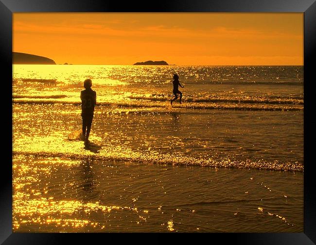 Childrens seaside splash Broadhaven sunset Framed Print by Lindsay Read