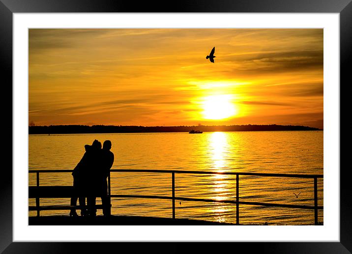 lovers at sunset Framed Mounted Print by nick wastie
