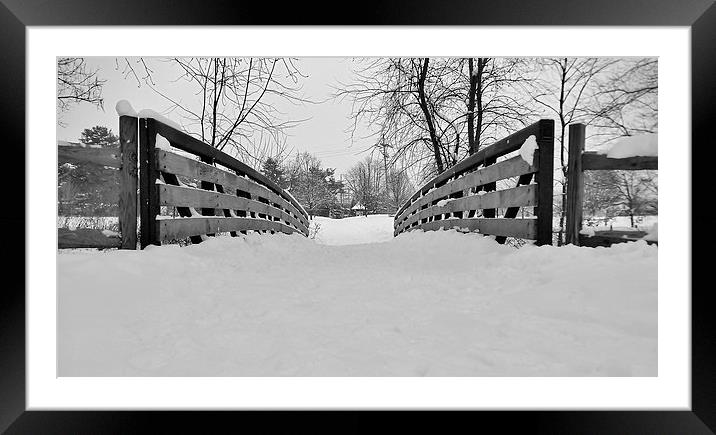 Snow covered bridge. Framed Mounted Print by Jeffrey Evans
