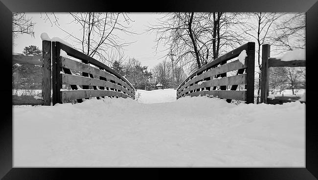 Snow covered bridge. Framed Print by Jeffrey Evans