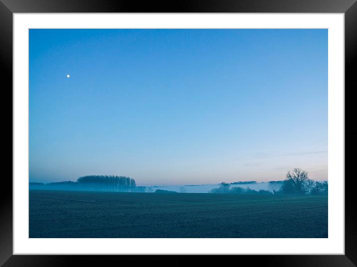 Moon over mist covered rural scene. Framed Mounted Print by Liam Grant