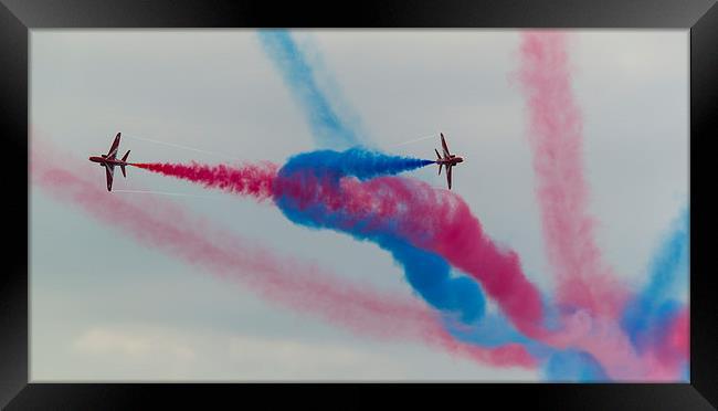 Two Red arrows crossing with smoke on Framed Print by Kenneth Dear