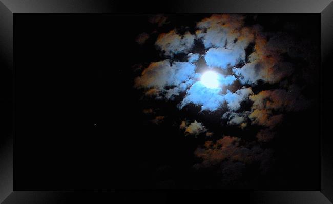 moon in the clouds Framed Print by david hopson