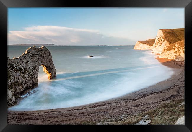 In the Shadow of Durdle Door Framed Print by Chris Frost
