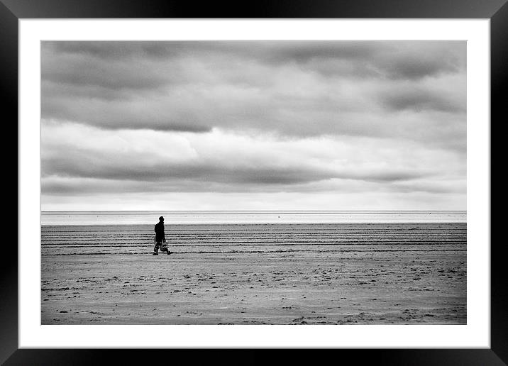 Beach walker Framed Mounted Print by Paul Walker