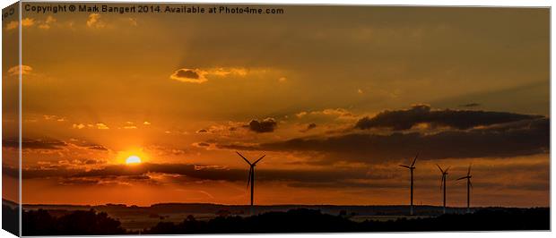 Wind turbines against the sunset Canvas Print by Mark Bangert